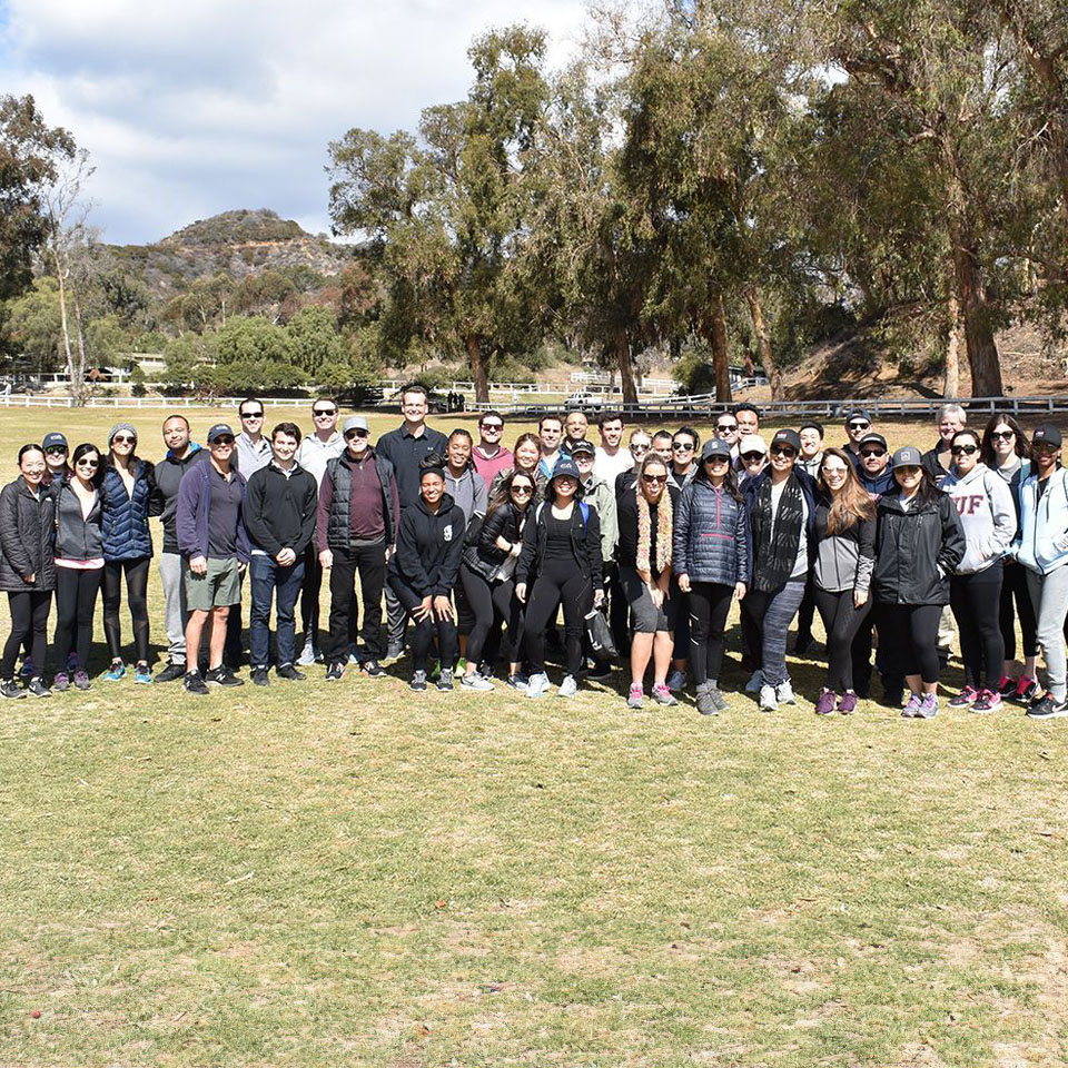 Photo of a large group of Rexford employees in a field