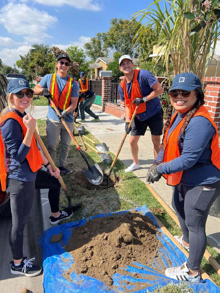 A group of Rexford employees participating in community building activities