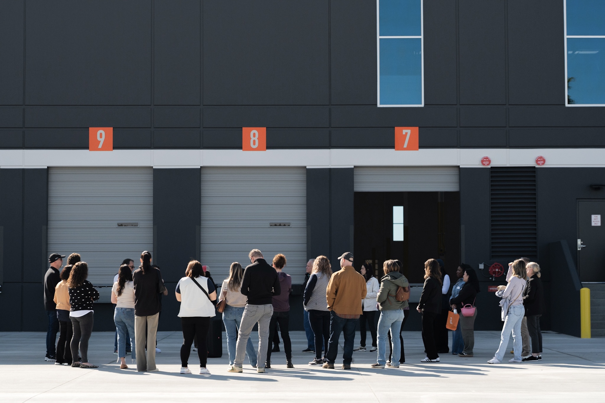 Rexford employees gathered outside of industrial dock doors