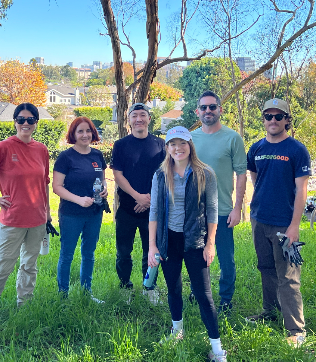 Group of Rexford employees at an outdoor volunteering event