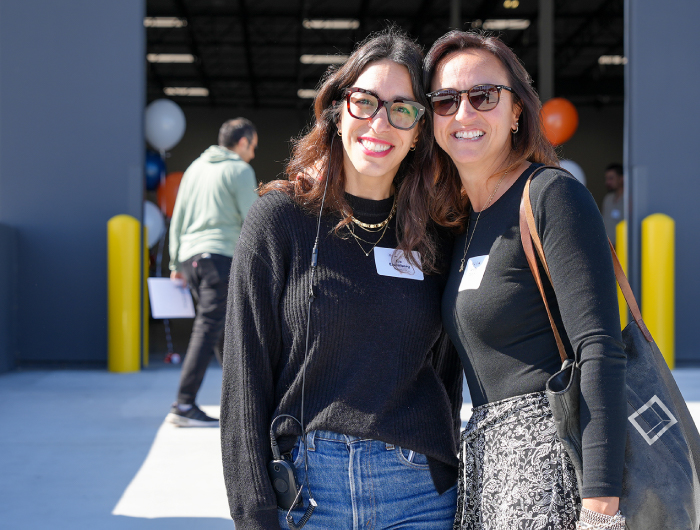 Two Rexford employees outside a warehouse dock door