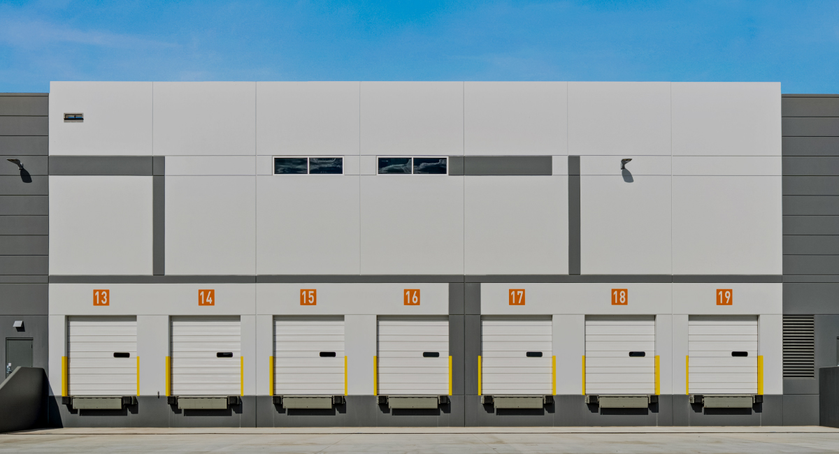 Line of exterior dock high doors in a loading bay