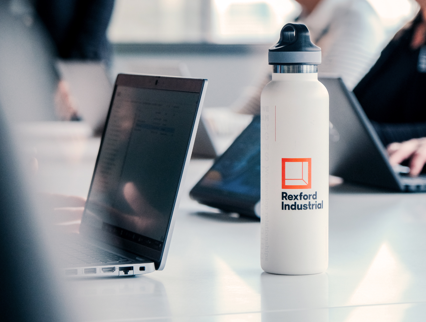 Rexford employees working in a conference room